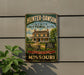 A vintage-style metal sign for the Hunter-Dawson State Historic Site in Missouri, featuring a house and a sign that says "Step back in time".