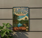 A vintage-style metal sign for Huntsville State Park in Texas, featuring a scenic landscape with a lake, bridge, and pine trees.