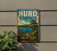 A vintage metal sign for Hurd State Park, featuring a scenic landscape with a lake, mountains, and pine trees.