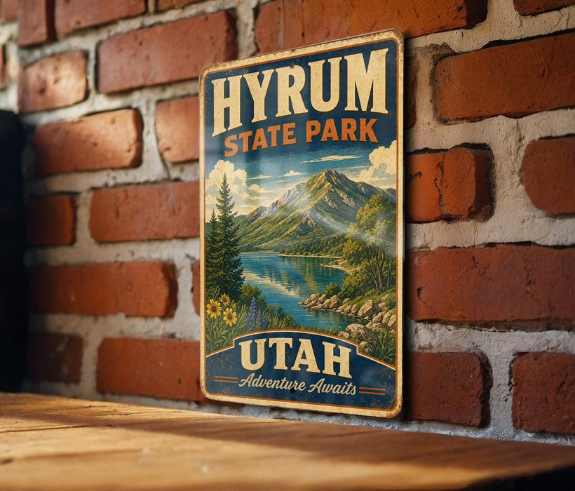 A vintage-style metal sign for Hyrium State Park in Utah, featuring a scenic mountain landscape with a lake and pine trees.