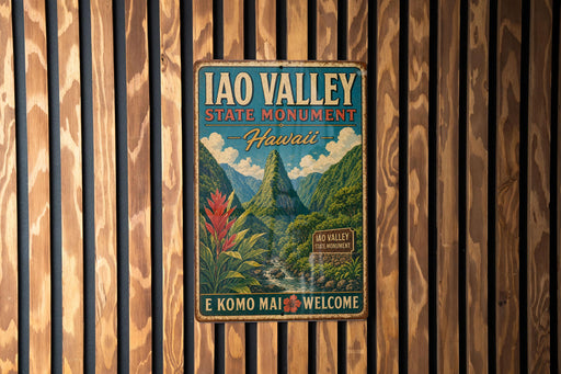 A vintage-style metal sign for the Iao Valley State Monument in Hawaii, featuring a mountainous landscape with a waterfall and tropical plants.