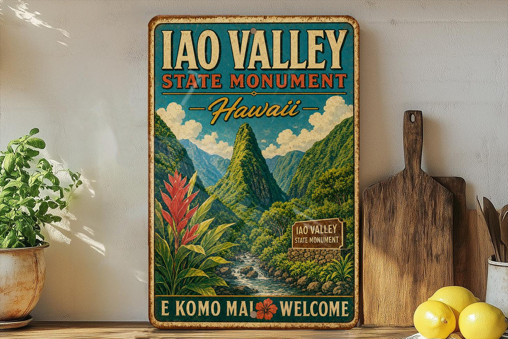 A vintage-style metal sign for the Iao Valley State Monument in Hawaii, featuring a mountainous landscape with a waterfall and tropical plants.