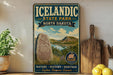 A vintage-style sign for Iceland State Park in North Dakota, featuring a scenic landscape with mountains, water, and a Viking ship.