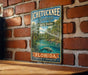 A vintage-style metal sign for Ichetucknee Springs State Park in Florida, featuring a scenic illustration of the park's natural surroundings.