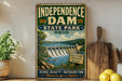 A vintage-style sign for Independence Dam, a scenic attraction in Ohio, featuring a dam, trees, and a river.