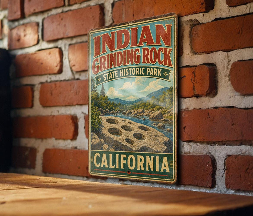 A vintage-style metal sign for Indian Grinding Rock State Historic Park in California, featuring a scenic landscape with mountains and a river.
