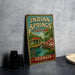 A vintage-style metal sign for Indian Springs State Park in Georgia, featuring a scenic illustration of a pond, gazebo, and waterfall.