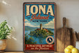 A vintage-style metal sign advertising "Iona Island New York" and "A Peaceful Retreat on the Hudson", featuring a scenic illustration of the island and its surroundings.