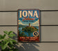 A vintage-style metal sign for Iona Island, New York, advertising a peaceful retreat on the Hudson.