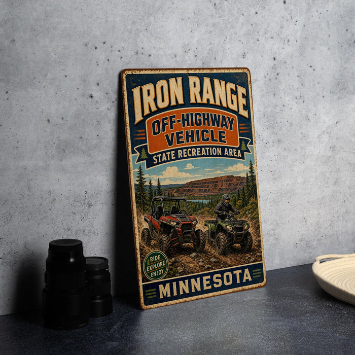 A vintage-style metal sign advertising Iron Range Off-Highway Vehicle State Recreation Area in Minnesota.