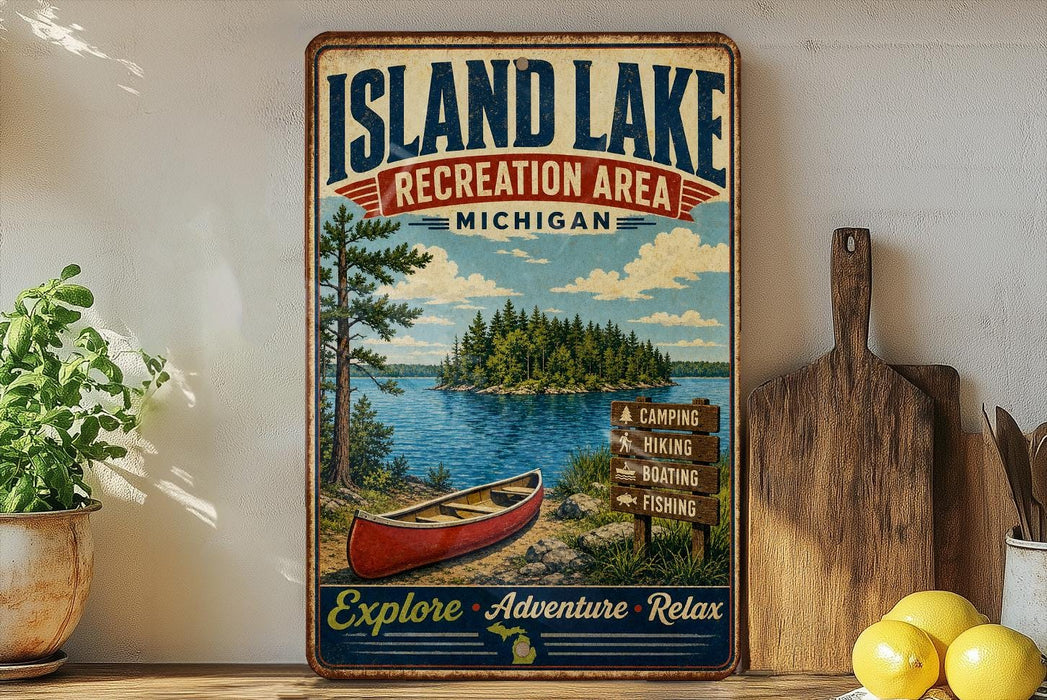 A vintage-style sign for the Island Lake Recreation Area in Michigan, featuring a red canoe and a scenic landscape with pine trees and a lake.