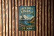 A vintage metal sign for the Jackson F. Kimball State Recreation Site in Oregon, featuring a scenic mountain landscape.