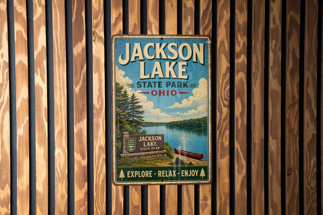 A vintage-style metal sign for Jackson Lake State Park in Ohio, featuring a scenic illustration of the lake and surrounding landscape.