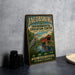 A vintage-style sign for the Jacobburg Environmental Education Center, featuring a blue heron and a red bridge, is displayed on a gray countertop.