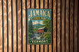 A vintage metal sign for Jamaica State Park in Vermont, featuring a scenic image of a covered bridge and a mountain backdrop.