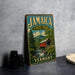 A vintage Jamaica State Park sign is displayed on a gray countertop, featuring a scenic illustration of a covered bridge and lush greenery.