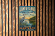 A vintage metal sign for James Island State Park, featuring an illustration of a heron and a scenic landscape.