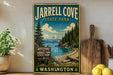 A vintage-style sign for Jarrell Cove State Park in Washington, featuring a scenic landscape with a lake, mountains, and pine trees.