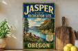 A vintage-style metal sign for the Jasper State Recreation Site in Oregon, featuring a scenic landscape with mountains, trees, and a river.