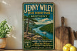 A vintage-style sign for Jenny Wiley State Resort Park in Kentucky, featuring a scenic mountain landscape with a river and a boat.