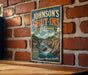 A vintage-style metal sign for Johnson's Shut-Ins State Park in Missouri, featuring a scenic illustration of a river and mountains.