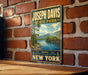 A vintage-style metal sign for Joseph Davis State Park, featuring a scenic landscape with mountains, trees, and a lake.