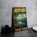 A vintage-style metal sign for Joseph Davis State Park, featuring a scenic landscape with a lake and mountains, is displayed on a gray concrete surface.