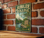 A vintage-style metal sign for Jubilee College State Park in Illinois, featuring a scenic landscape with a river and trees.