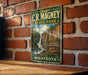 A vintage-style metal sign for C.R. Magney State Park in Minnesota, featuring a scenic image of a waterfall and forest.