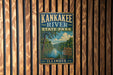A vintage metal sign for Kankakee River State Park in Illinois, featuring a scenic illustration of the river surrounded by nature and adventure memories.