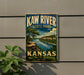 A vintage metal sign for Kaw River State Park in Kansas, featuring a scenic landscape with a river and trees.