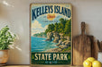 A vintage-style metal sign for Kelley's Island, Ohio, featuring a scenic landscape with a lake and rocky cliffs.