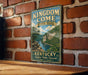 A vintage-style sign for Kingdom Come State Park in Kentucky, featuring a scenic landscape with a river and forest.