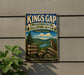 A vintage-style sign for the Kings Gap Environmental Education Center in Pennsylvania, featuring a scenic mountain landscape with a bird perched on a rock.