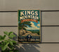 A vintage metal sign for Kings Mountain State Park in South Carolina, featuring a scenic landscape with a tree, rocks, and a cloudy sky.