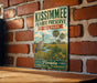 A vintage metal sign for Kissimmee Prairie Preserve, featuring a bird and palm trees, is displayed on a brick wall.