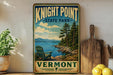 A vintage-style sign for Knight Point State Park in Vermont, featuring a scenic landscape with a lake, mountains, and a wooden bench.