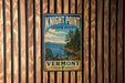 A vintage-style metal sign for Knight Point State Park in Vermont, featuring a scenic landscape with a lake, mountains, and pine trees.