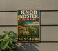 A vintage-style metal sign for Knob Noster State Park in Missouri, featuring a scenic landscape with mountains and trees.