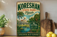 A vintage-style sign for Koreshan State Park in Florida, featuring a tropical landscape with palm trees, a building, and a body of water.