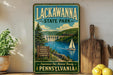 a vintage-style sign for Lackawanna State Park, with a scenic illustration of a river, bridge, and sailboat.