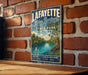 A vintage-style metal sign for Lafayette Blue Springs State Park in Florida, featuring a scenic illustration of the park's natural surroundings.