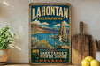 A vintage-style sign for Lake Tahoe, Nevada, featuring a scenic landscape with mountains, water, and a seagull.