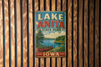 A vintage metal sign for Lake Anita State Park in Iowa, featuring a scenic illustration of a lake, canoe, and surrounding landscape.
