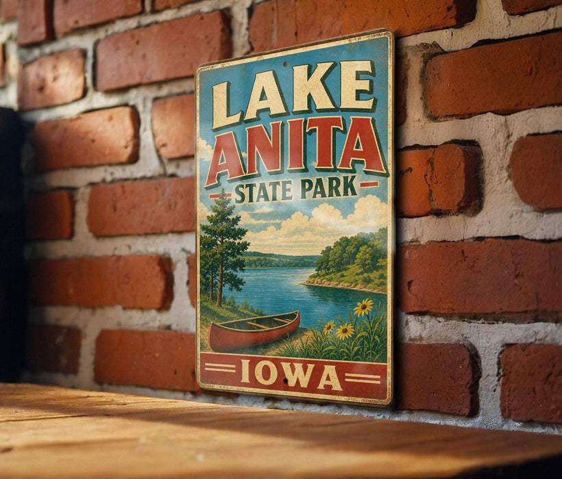 A vintage-style metal sign for Lake Anita State Park in Iowa, featuring a scenic illustration of a lake, canoe, and surrounding landscape.