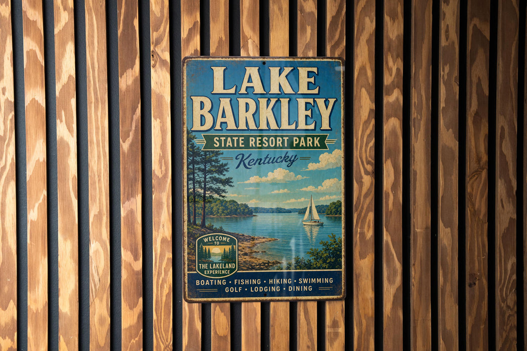 A vintage metal sign for Lake Barkley State Resort Park in Kentucky, featuring a scenic image of the lake and surrounding landscape.