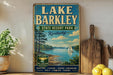 A vintage-style sign for Lake Barkley State Resort Park in Kentucky, featuring a scenic image of a lake with a sailboat, surrounded by trees and mountains.