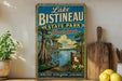 A vintage-style sign for Lake Bistineau State Park in Louisiana, featuring a scenic illustration of the park's natural beauty and outdoor activities.
