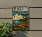 A vintage-style sign for Lake Carlos State Park in Minnesota, featuring a canoe and a scenic landscape.