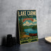 A vintage-style metal sign for Lake Carmi State Park in Vermont, featuring a scenic illustration of a lake, mountains, and a canoe.